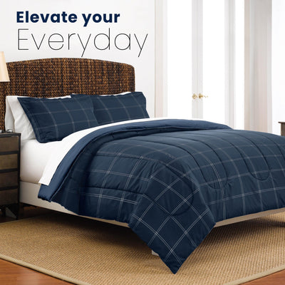 Navy checkered comforter set on a bed with text 'Elevate your Everyday' in a bedroom setting.