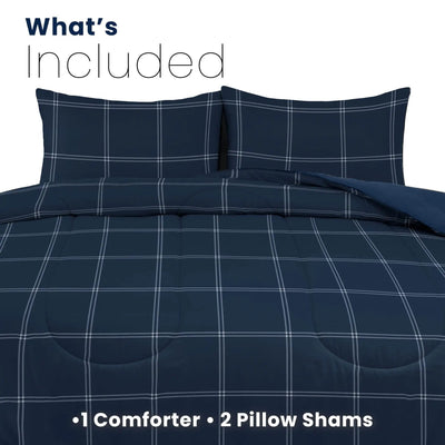 A navy blue comforter set with two matching pillow shams featuring a white windowpane plaid pattern, shown with 'What's Included' and '1 Comforter and 2 Pillow Shams' text overlays on a white background.