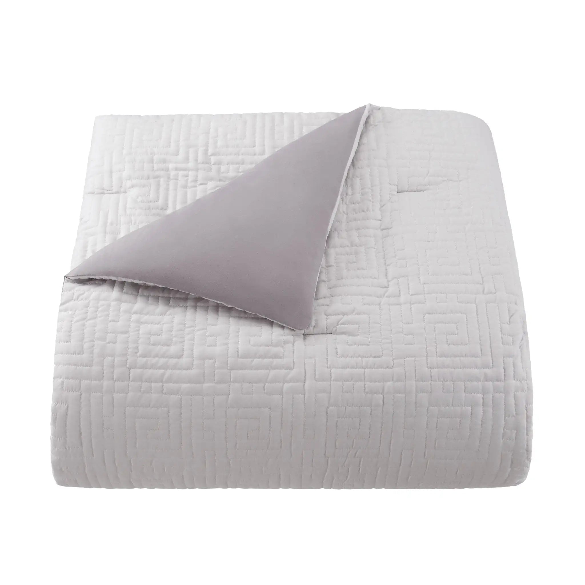 Gray comforter with a textured pattern on a white background