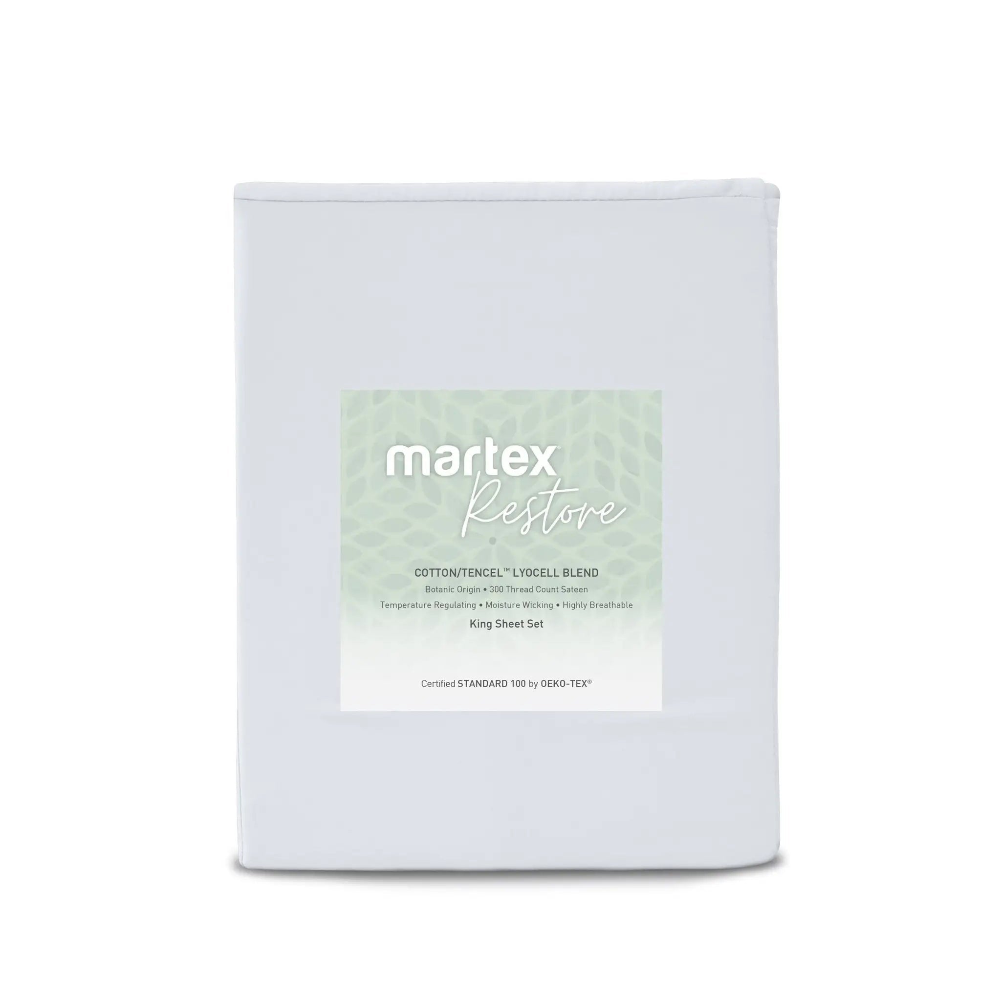 A folded white bedding sheet set package labeled 'martex Restore' with a pale green patterned label, photographed on a clean white background.