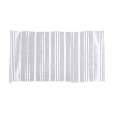 Rectangular grey bath towel  silo with horizontal stripes on a white background
