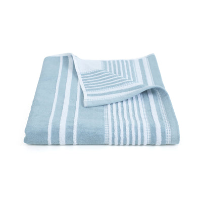 Folded mineral and white striped towel on a white background