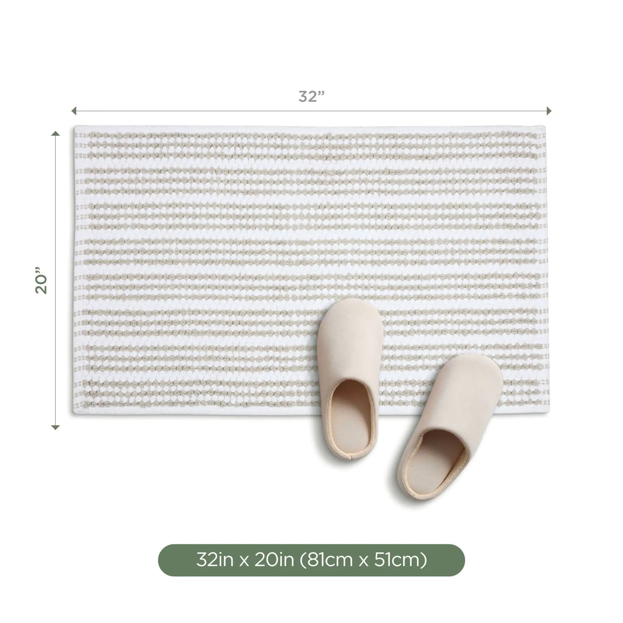 A rectangular sand bath rug showing dimension markers of 32 inches by 20 inches, with a pair of beige slip-on slippers placed on top. A green label at the bottom reads '32in x 20in (81cm x 51cm)'.