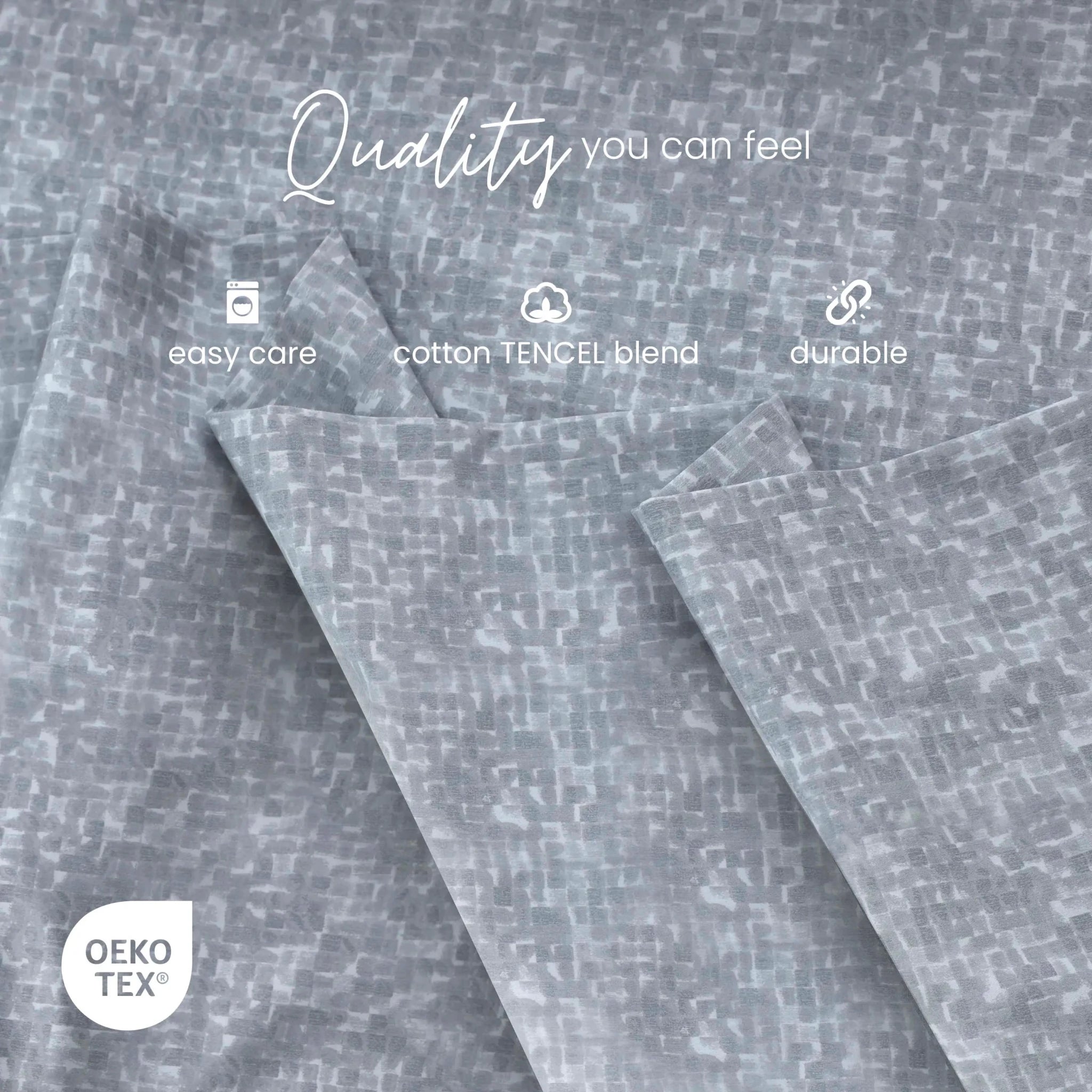 Gray patterned fabric with a subtle woven texture, shown folded with white text overlays reading 'Quality you can feel', 'easy care', 'cotton TENCEL blend', and 'durable', plus an OEKO-TEX certification badge.
