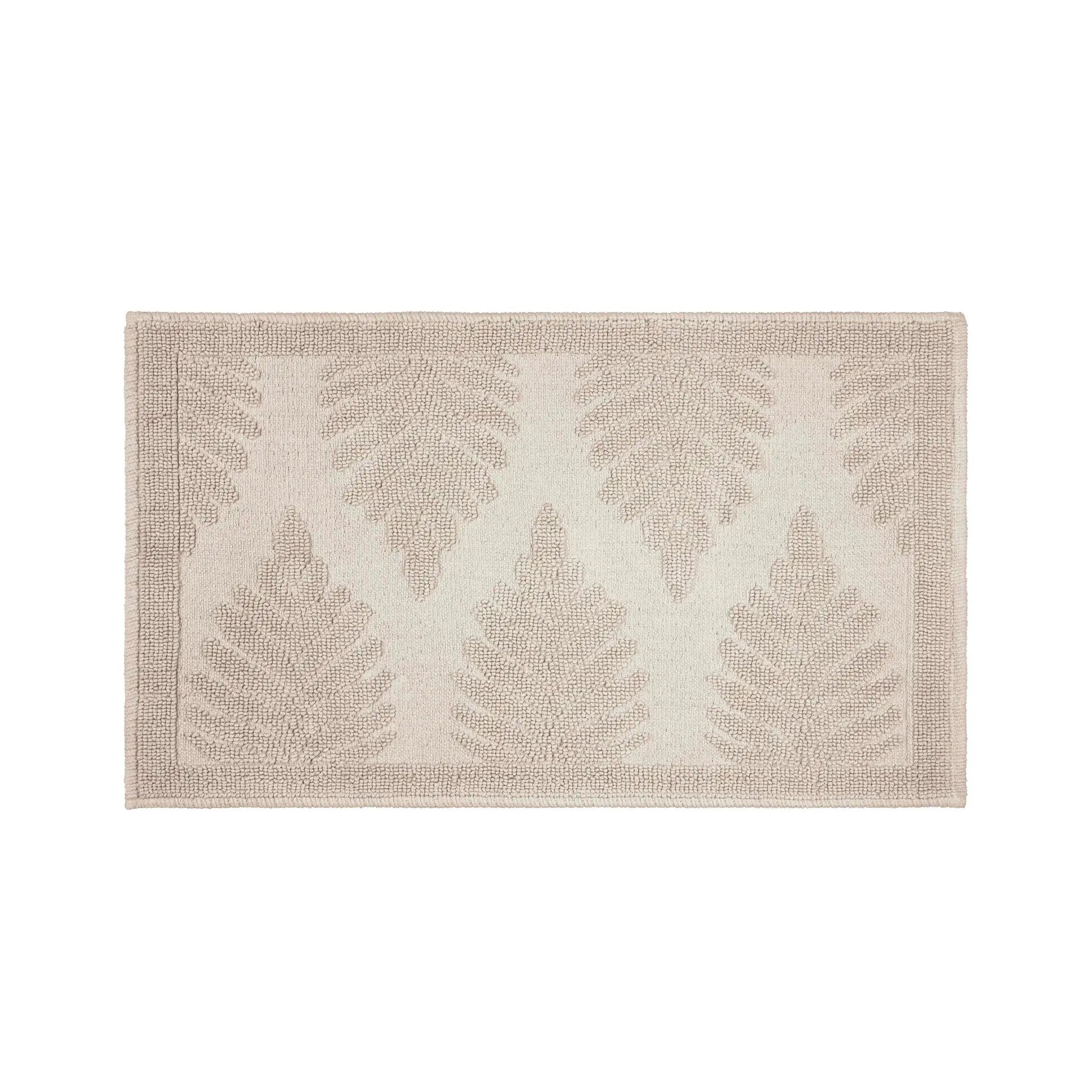 A sand-colored bathmat with a textured, shown flat against a solid white background.