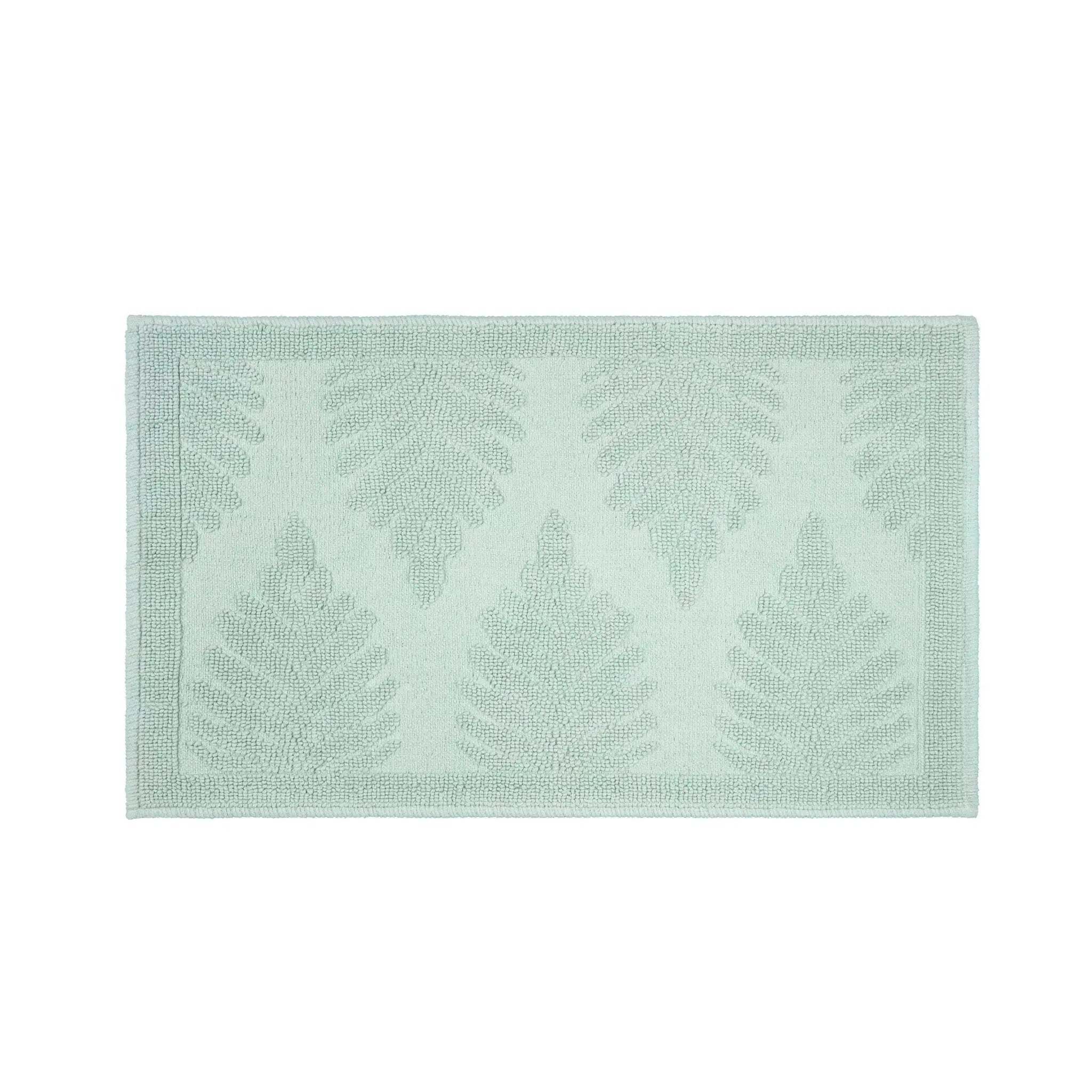 A rectangular sage bath rug shown against a plain white background.