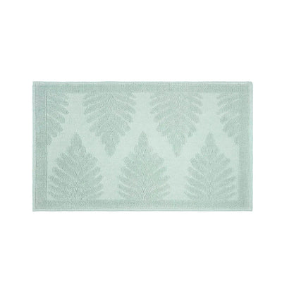A rectangular sage bath rug shown against a plain white background.