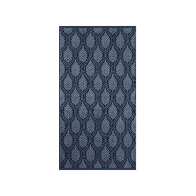 A navy bath towel with vertical pattern of stylized leaf or feather motifs in shades of blue and gray on a dark navy background, shown against a plain white background.