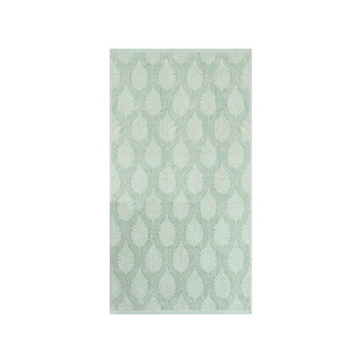 A sage bath towel with leaf pattern in sage green and white, shown flat against a solid white background.