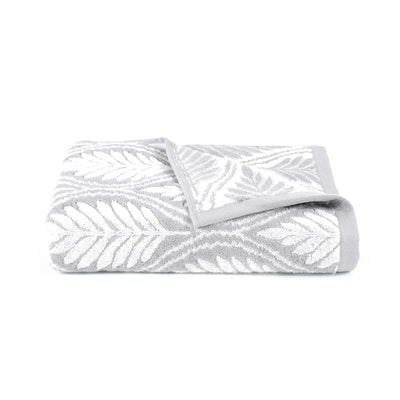 Grey textured bath towel on a white background