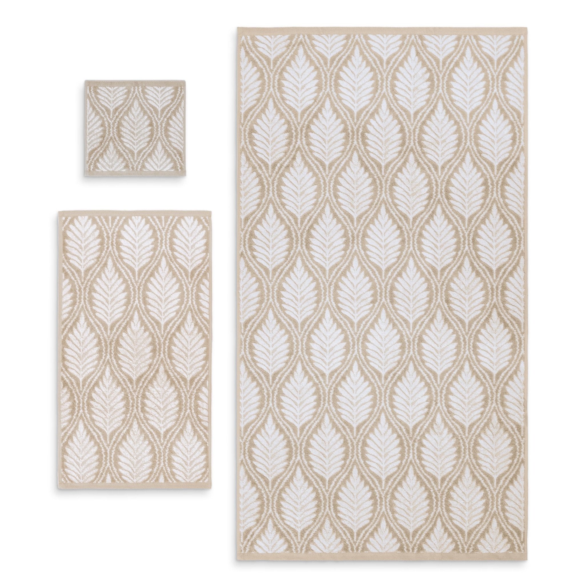 Set of three sand patterned towels on a white background