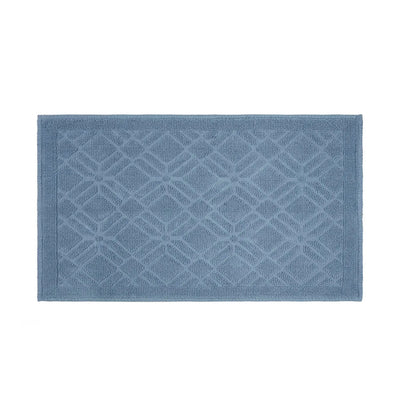 A rectangular blue bath rug with a raised geometric diamond pattern and a solid border, shown flat against a white background.