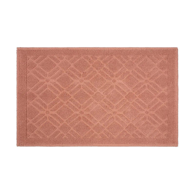 A rectangular clay-colored bath rug with a raised geometric diamond lattice pattern and a matching border, shown flat against a solid white background.