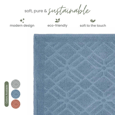 A close-up of a textured blue bath rug with a geometric diamond pattern, shown on a white background with marketing text and color swatches.