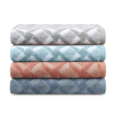 A stack of four folded towels with a repeating diamond pattern in soft neutral and pastel colors, including gray, blue, clay, and mineral, on a white background.
