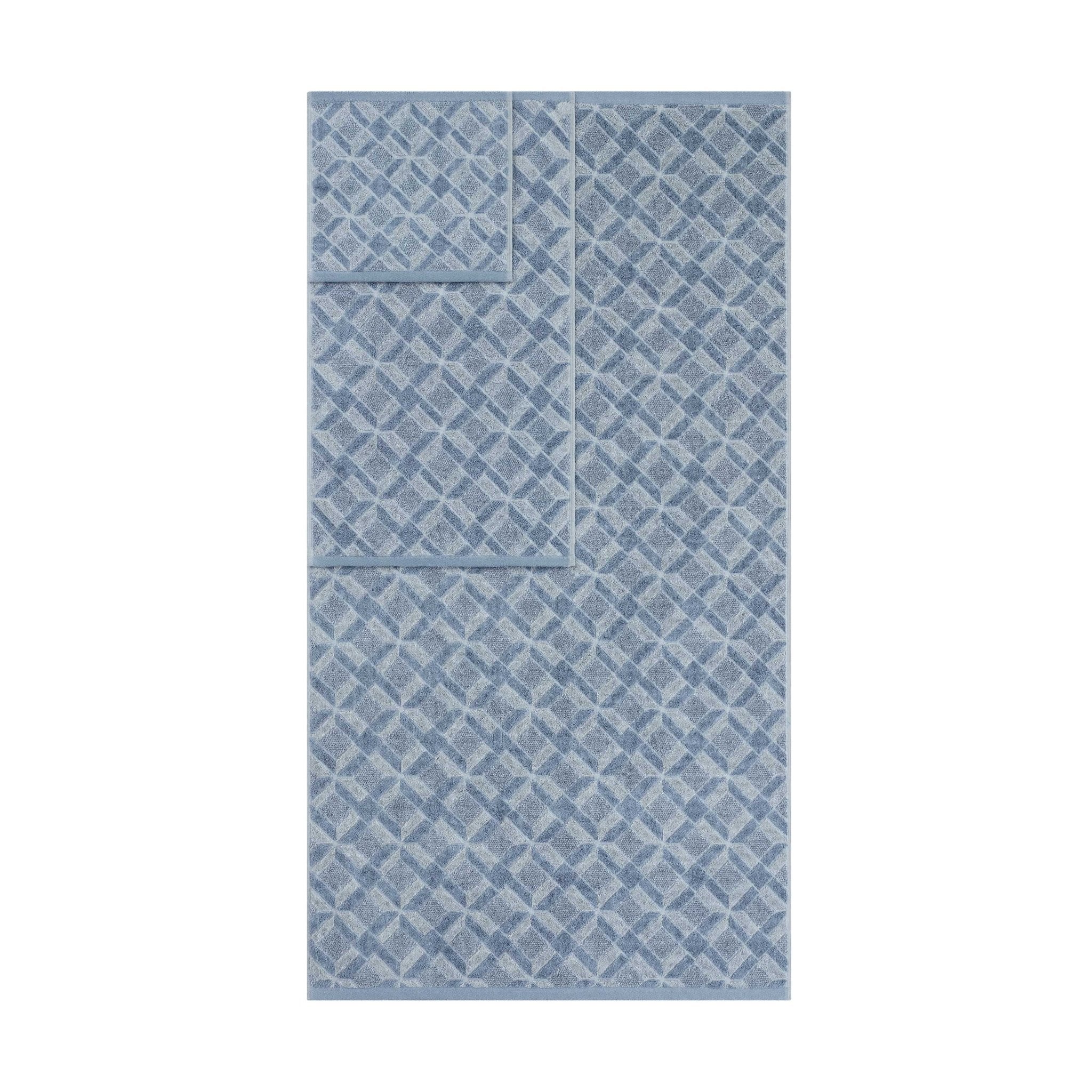 Blue patterned towels on a white background