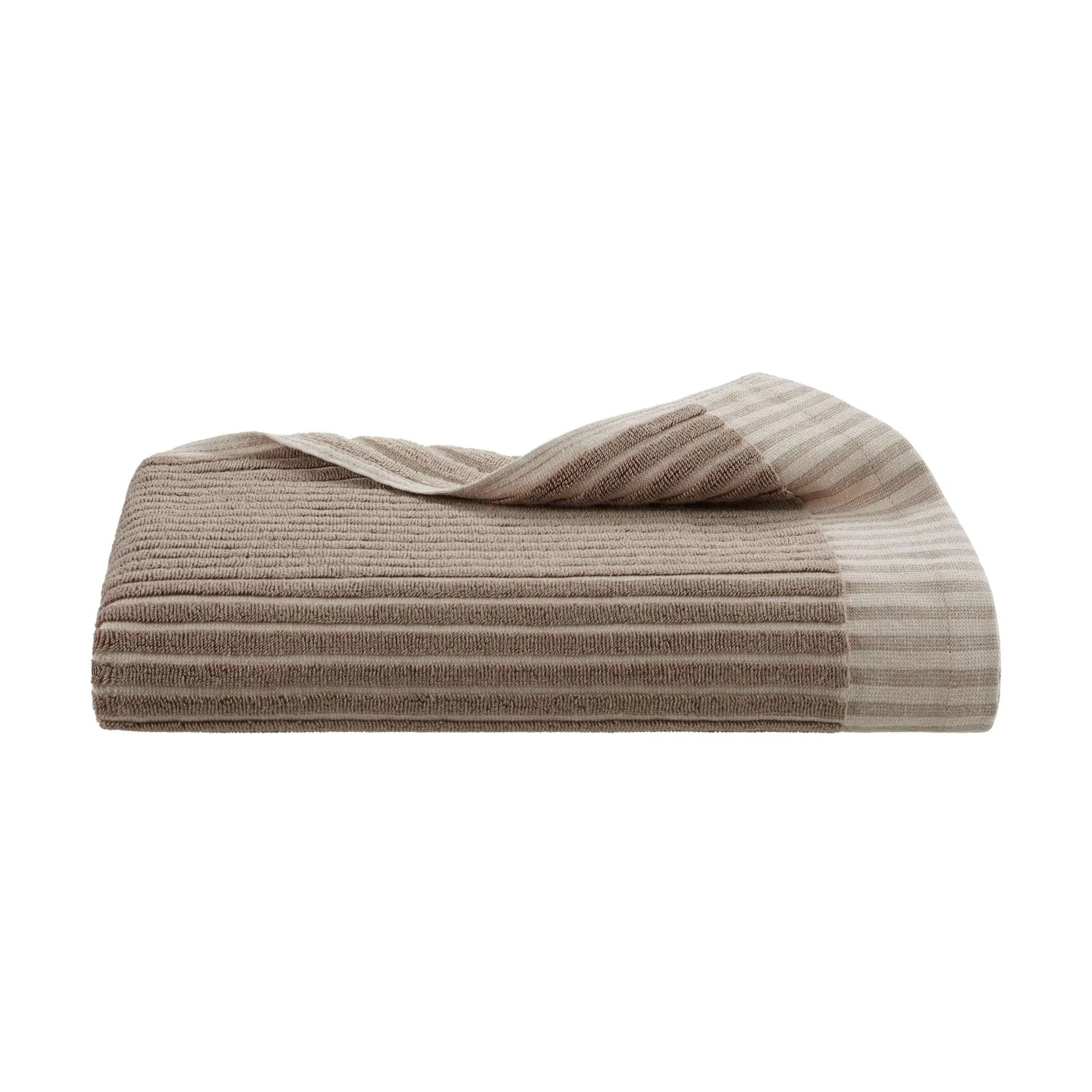 Tan bath towel on a white background