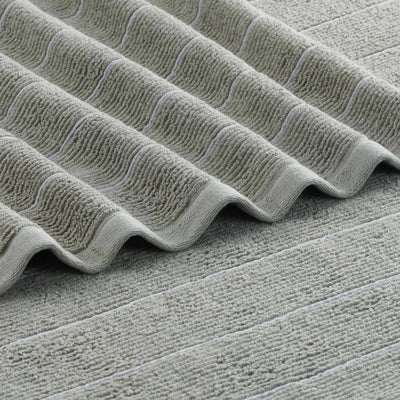 Close-up of a textured gray surface with wavy patterns