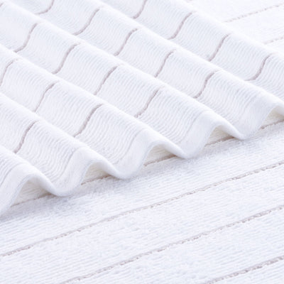 Close-up of textured white fabric with wavy pattern