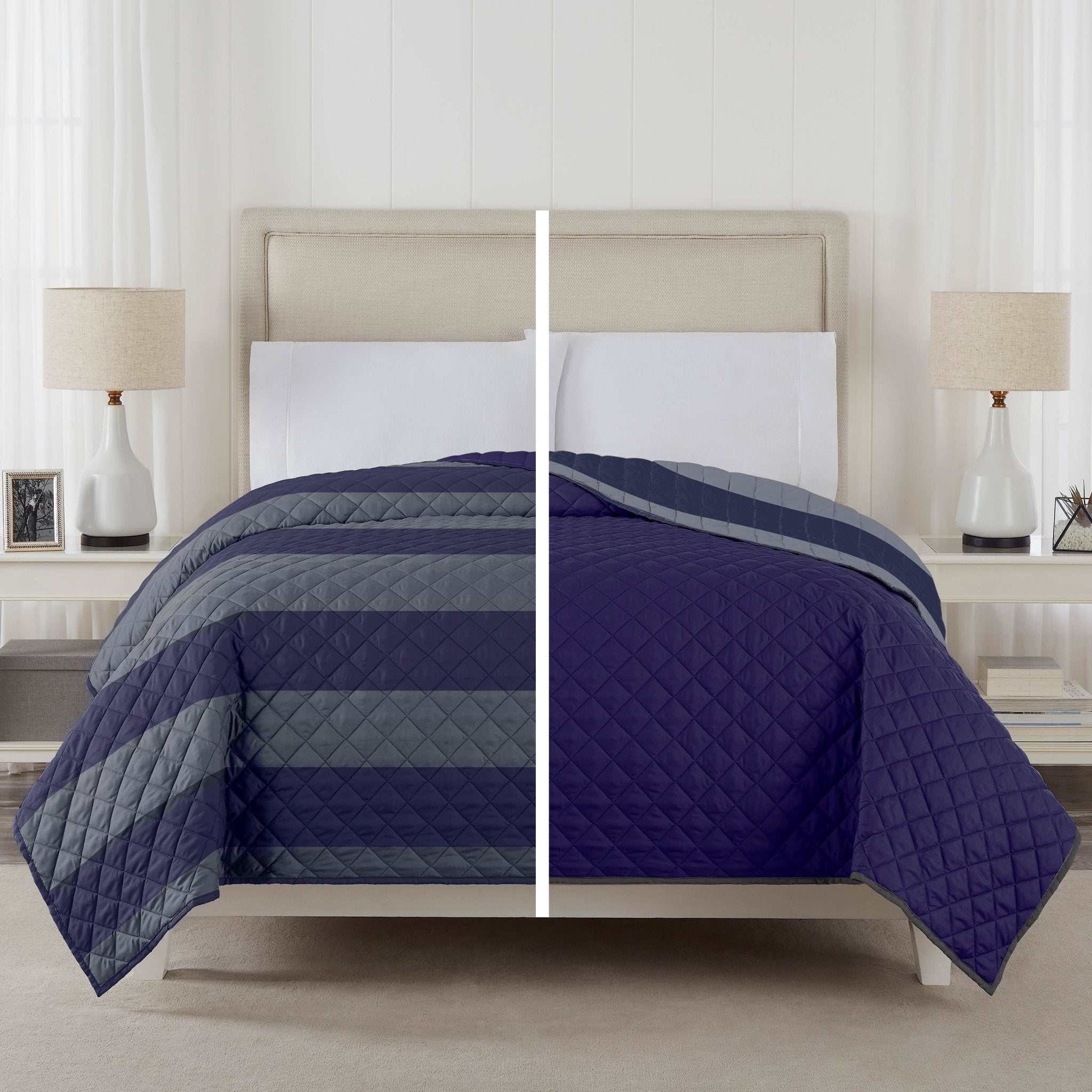 Bed with striped and quilted navy blue coverlet in a bedroom setting.