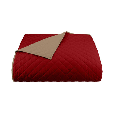 Khaki/red reversible coverlet on a white background