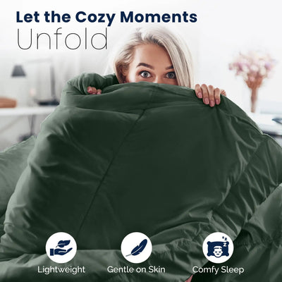 Woman hugging an olive comforter with text 'Let the Cozy Moments Unfold' and icons for lightweight, gentle on skin, and comfy sleep.