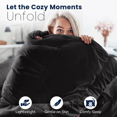 Woman hugging ebony comforter with text 'Let the Cozy Moments Unfold' and icons for lightweight, gentle on skin, and comfy sleep.