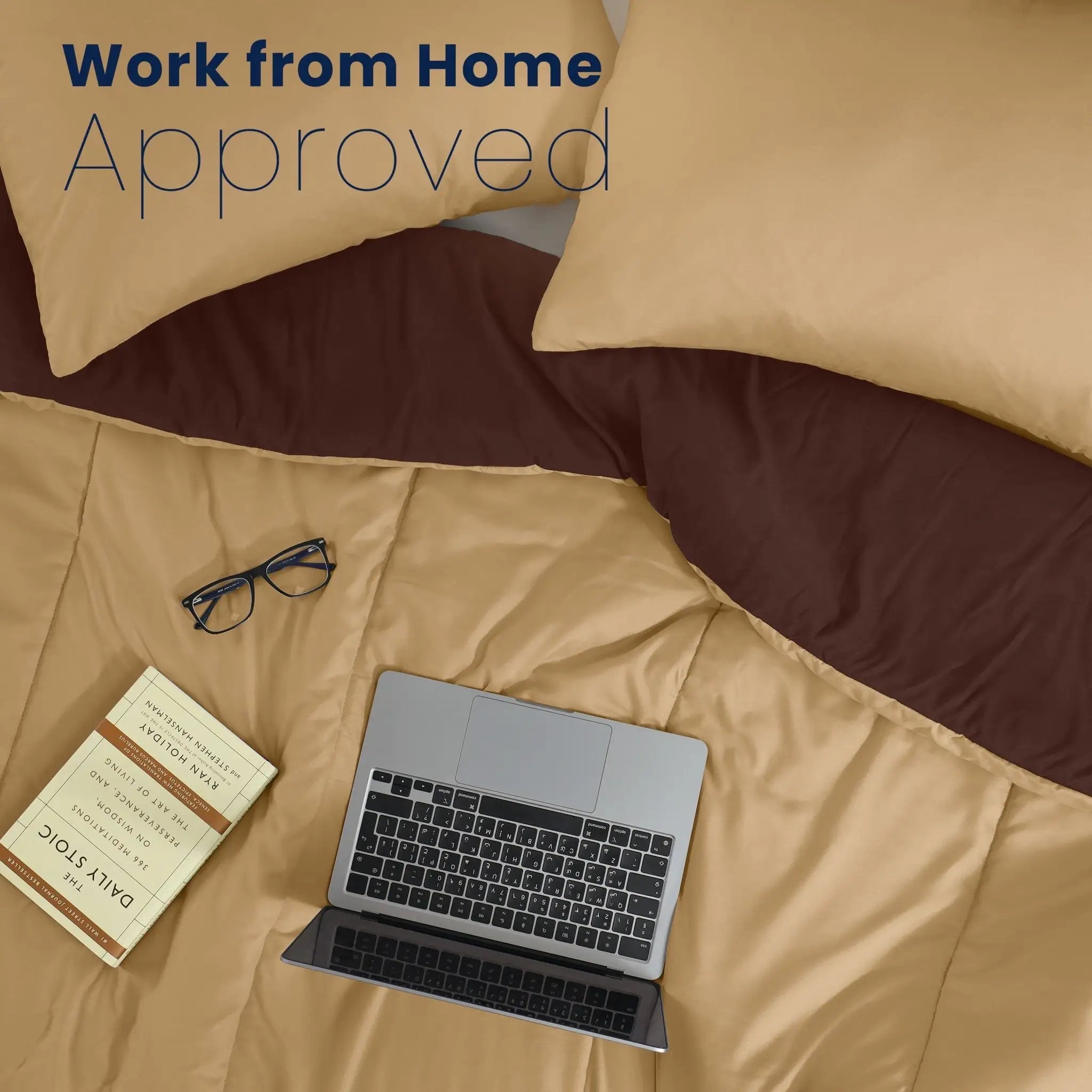 Khaki bedding with a chocolate color reversible side, two khaki pillow shams, a laptop, eyeglasses, a book, and the text 'Work from Home Approved' at the top.