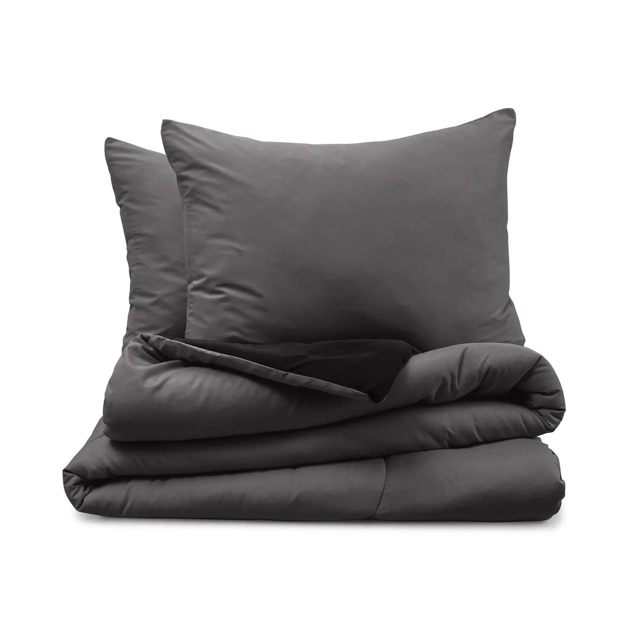 Graphite comforter with two pillow shams on a white background