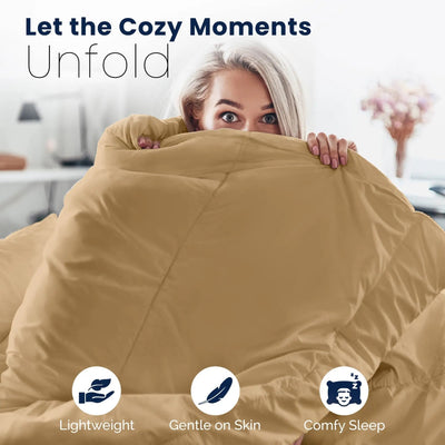 Woman wrapped in a khaki comforter with text 'Let the Cozy Moments Unfold' and icons for lightweight, gentle on skin, and comfy sleep.
