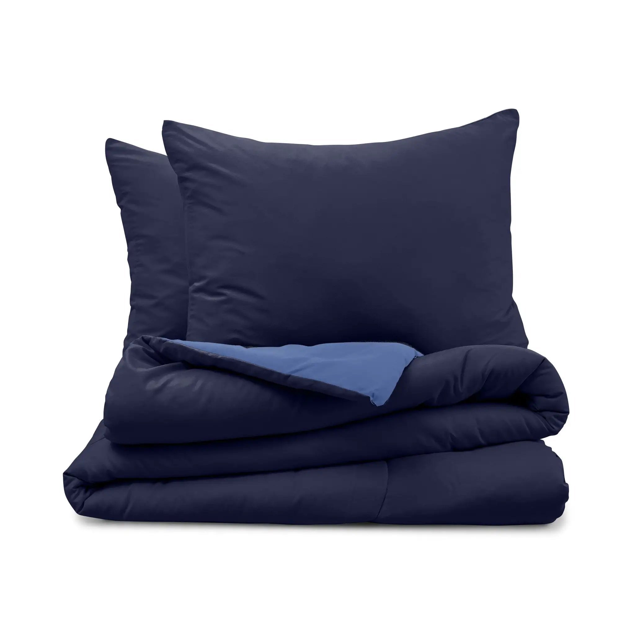 Navy blue bedding set with two pillow shams and a folded comforter on a white background