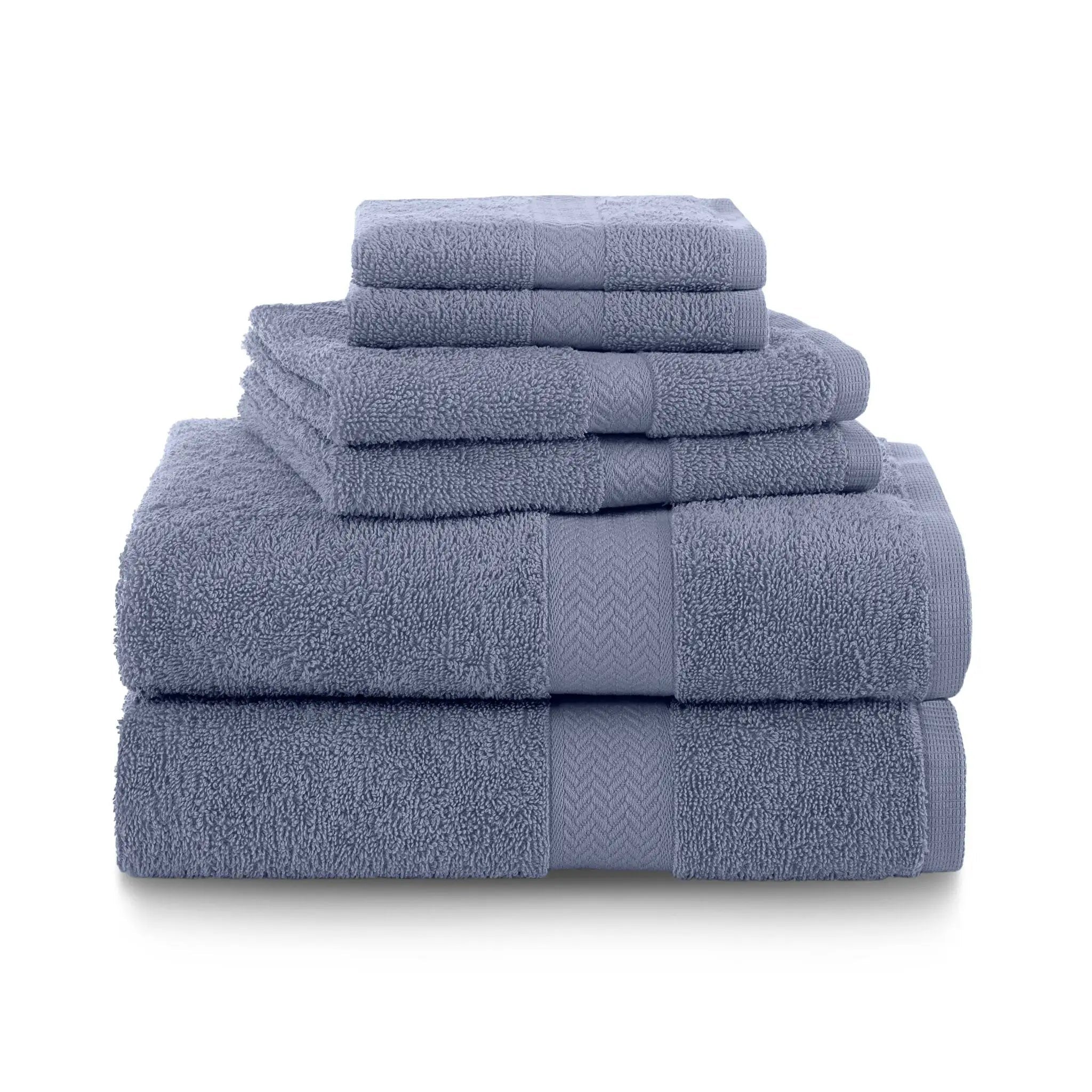 Set of heather blue towels stacked on a white background