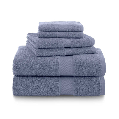 Set of heather blue towels stacked on a white background