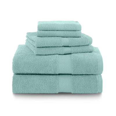 Set of beach glass color towels stacked on a white background