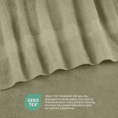 Close-up of textured sage green fabric with OEKO-TEX logo and text.