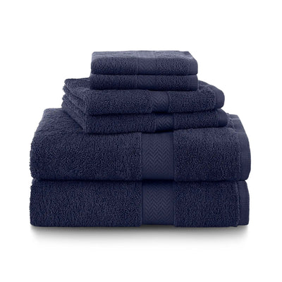 Set of navy blue towel set stacked on a white background