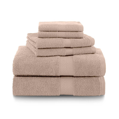 Stack of sand color towel set on a white background