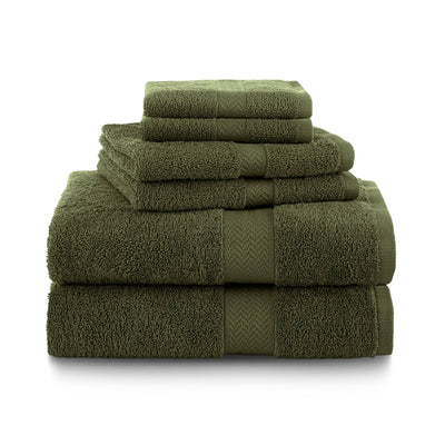 Stack of dark green towels on a white background