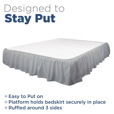 A bed skirt in grey shown on a bed with a white mattress, with text reading 'Designed to Stay Put' and feature bullet points on a white background.
