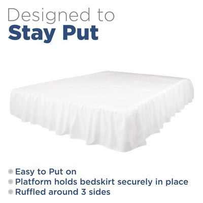 A bed skirt in white shown on a bed with a white mattress, with text reading 'Designed to Stay Put' and feature bullet points on a white background.