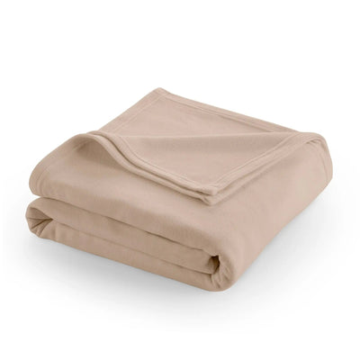 Folded beige blanket on a white background