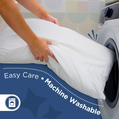 Person placing a white comforter into a washing machine with text 'Easy Care • Machine Washable' on a blue background.