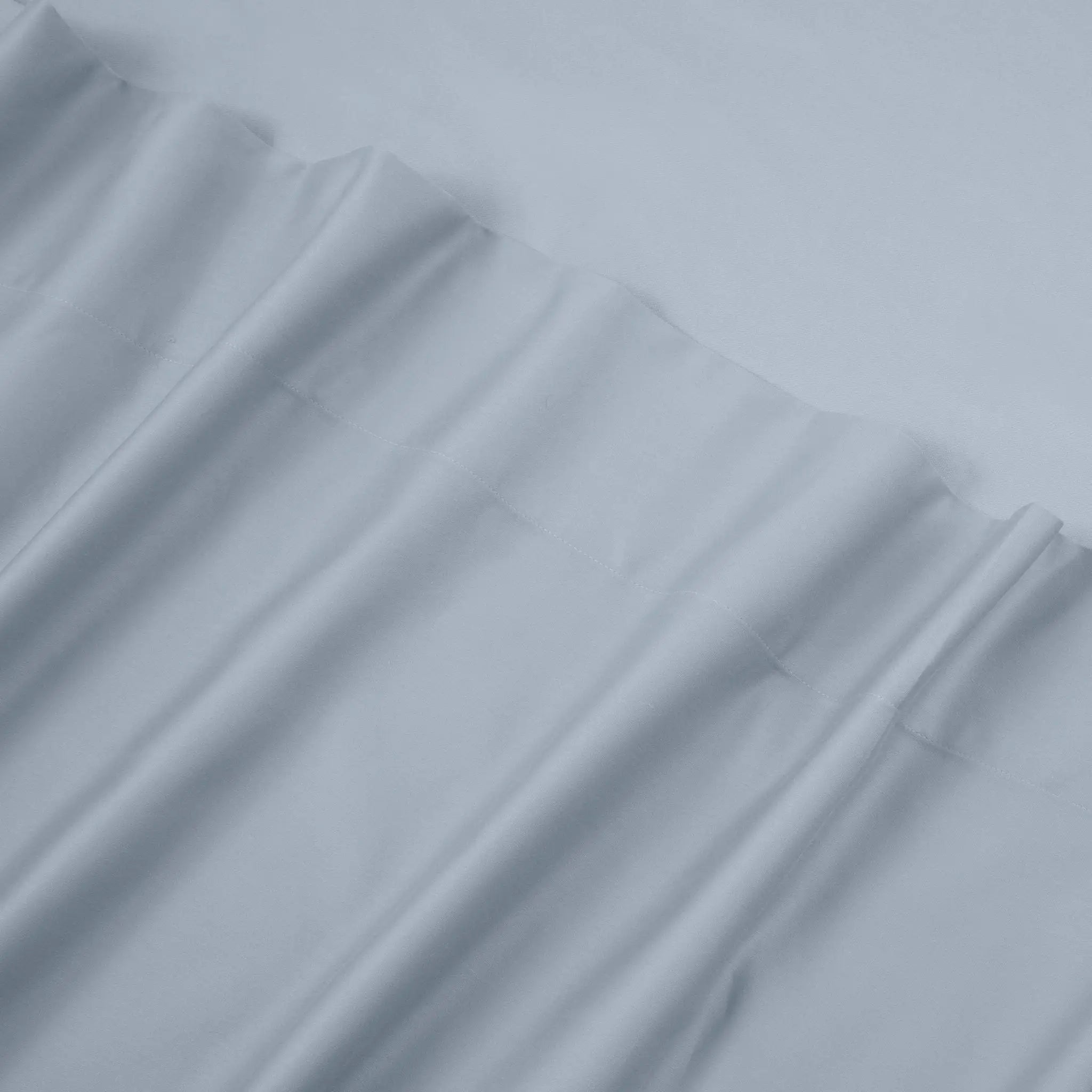 Stack of blue sheets with a textured surface