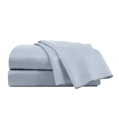 Set of light blue bed sheets on a white background