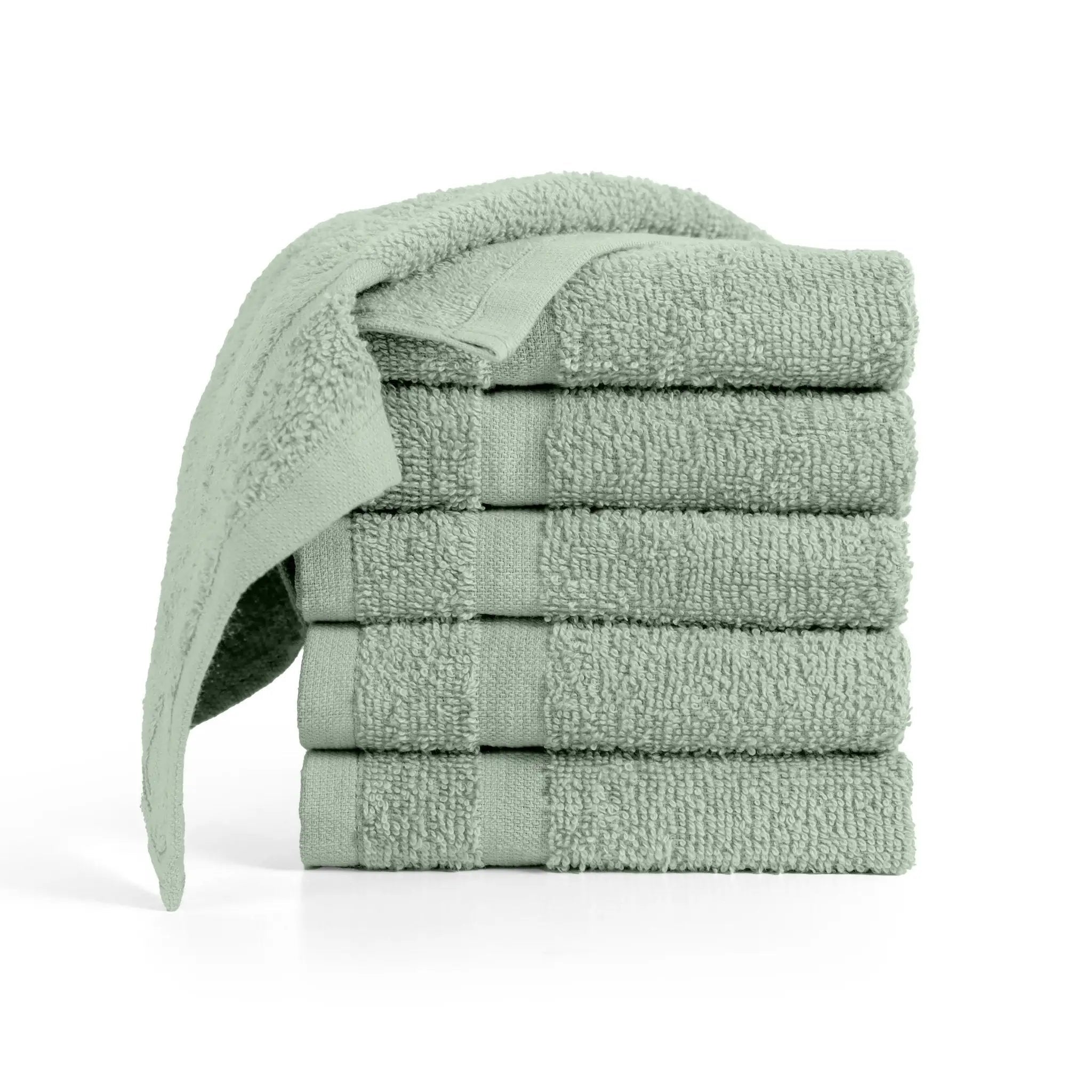 Stack of sage washcloths on a white background