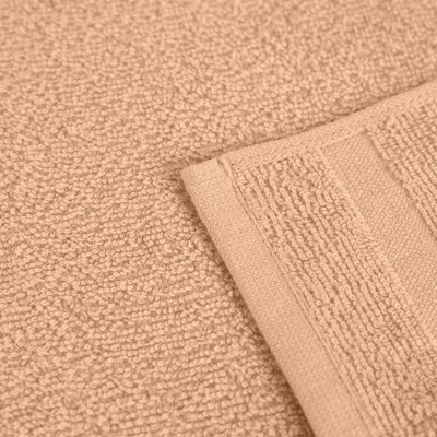 Close-up of textured peach fabric with a folded corner