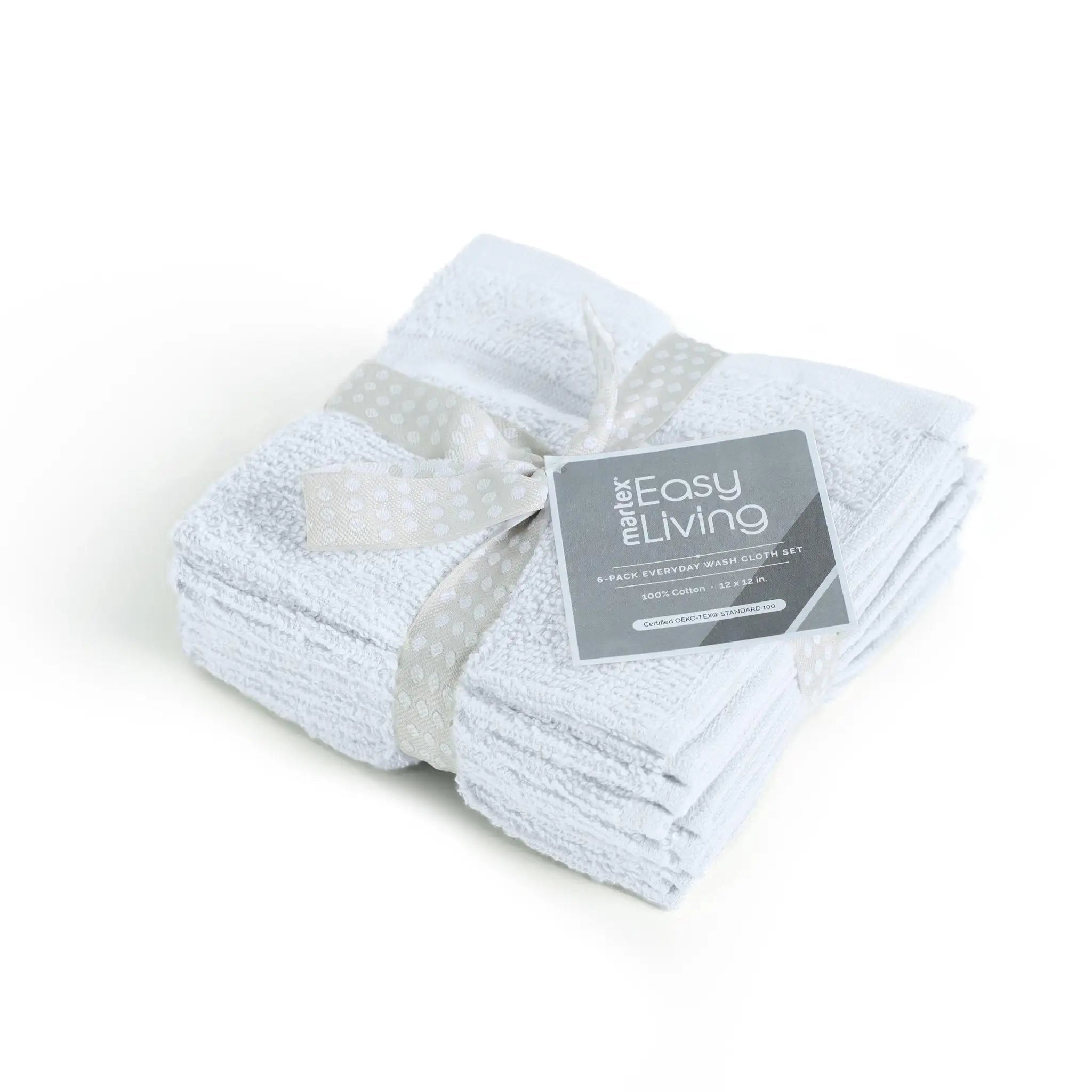 A set of four folded white washcloths tied with a white patterned ribbon and a gray product tag.