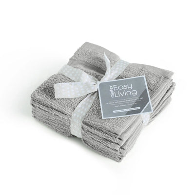 Stack of gray washcloths with a white ribbon and 'Martex Easy Living' label on a white background