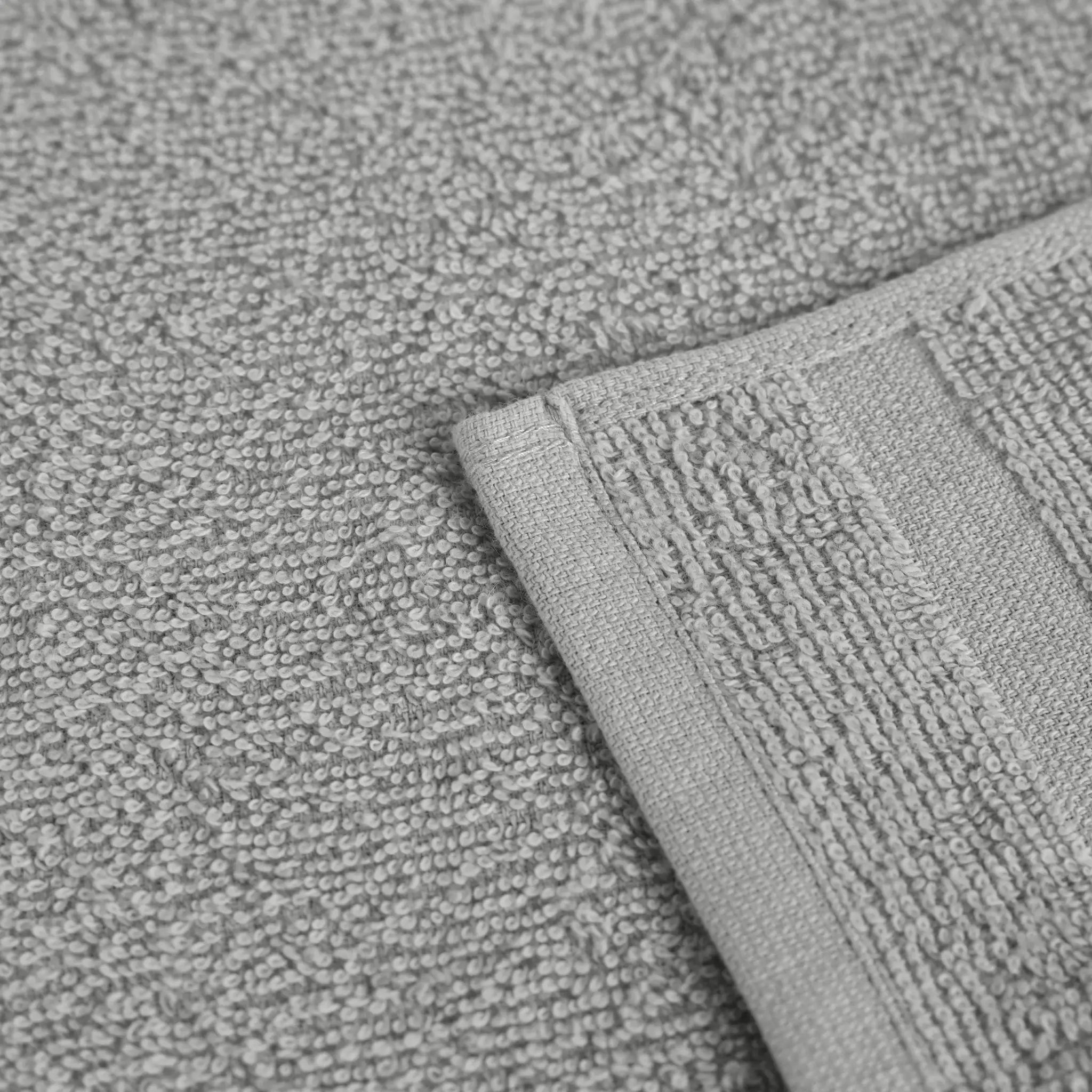 Close-up of a textured gray fabric with a folded edge