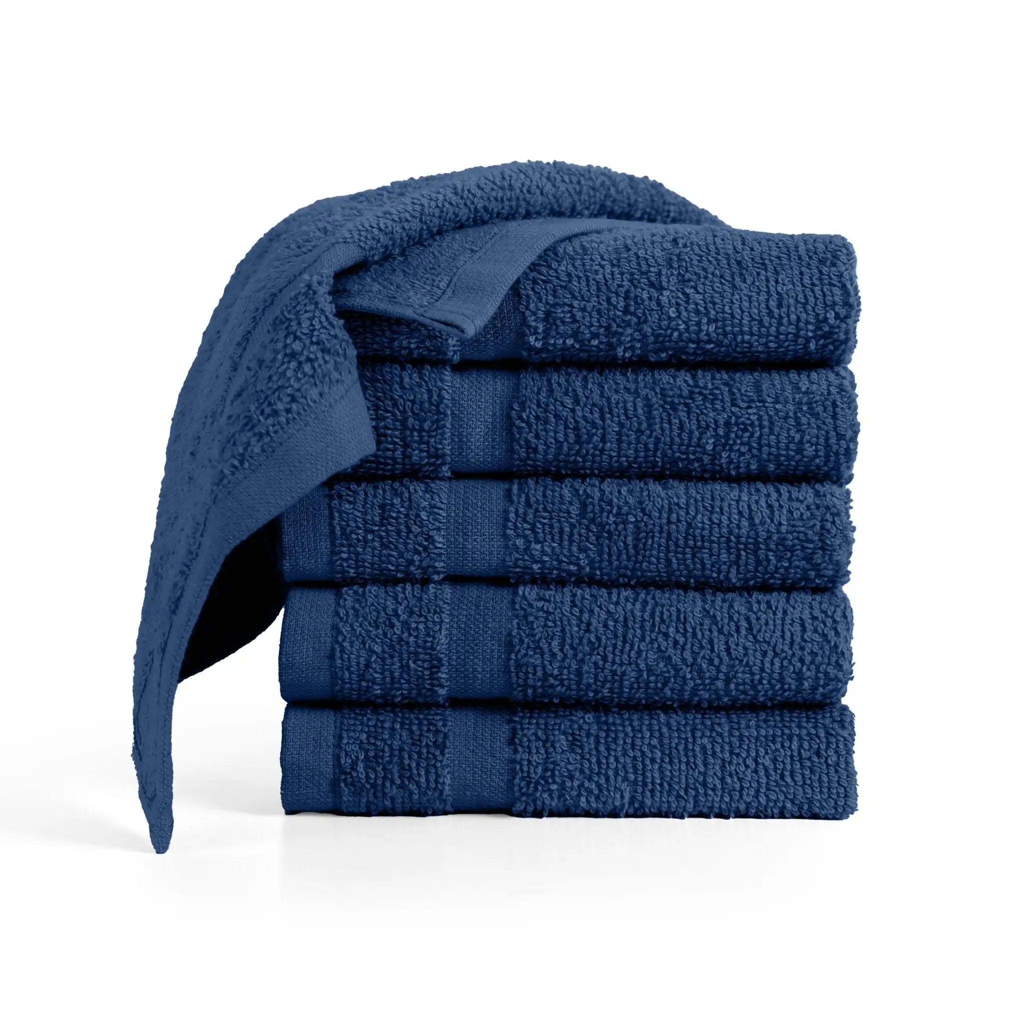 Stack of navy washcloths on a white background
